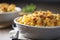 A hearty bowl of creamy macaroni and cheese with a crispy breadcrumb topping. 